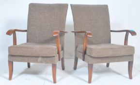 Parker Knoll - A pair of mid century Parker Knoll P.K. 717 vintage open framed armchairs / easy