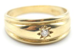 A hallmarked 9ct gold gypsy ring being set with a round cut white stone in a star setting. Assay