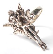 A stamped .925 silver ladies dress ring in the form of a winged fairy. Weighs 7.7g. Size P.