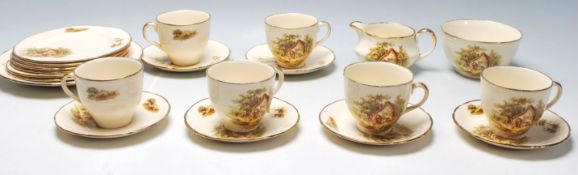 An early 20th century Alfred Meakin English tea service to include six cups, six saucers plates, a