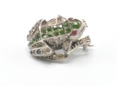 A vintage 20th Century brooch in the for of a frog being set with multi coloured stones. Weight