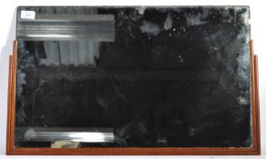 An original early 20th Century retro vintage Art Deco wall mirror having a stepped ebonised frame