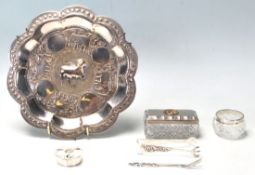A collection of silver items to include a silver continental 800 grade fancy sugar tongs and