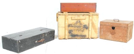 A group of four wooden storage boxes to include a