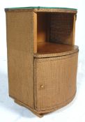 A 1950's Lloyd Loom style demi-lune pedestal / bedside cabinet painted in gold with a glass top &