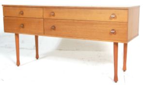 A vintage mid 20th Danish inspired teak wood sideboard/chest of drawers, having four drawers
