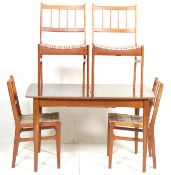A vintage retro 1970's Jentique teak wood extending dining table together with four Portwood retro