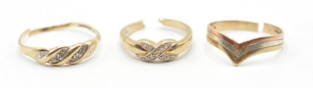 A group of three 9ct gold ladies rings to include a three tone wishbone ring (hallmarked 375), a