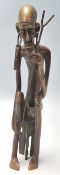 A vintage 20th Century Polynesian / Aboriginal bronze figure of a tribal elder with large earrings