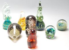 A good collection of eight mid century vintage retro studio art glass paperweights to include: