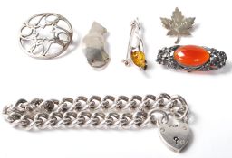 A collection of vintage silver jewellery to include a silver hallmarked heavy curb link heart lock