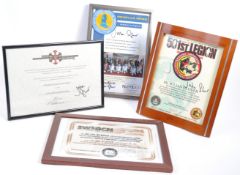 COLLECTION OF FRAMED PRESENTATIONS TO JULIAN GLOVER