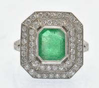 A Platinum Emerald & Diamond Cocktail Ring.