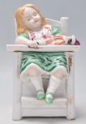 A 19th century continental glazed porcelain figuri