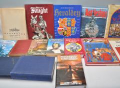 A mixed group of hardback and paperback military r