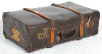 A vintage 20th Century dark brown leather and wood