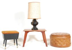 A retro mid 20th Century sewing stool having a ora