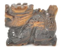 A small Chinese tiger's eye figure in the form of