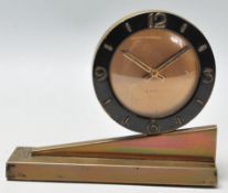 A 1920's Art Deco 8 days mantel clock having a rou