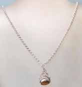 A silver pendant necklace with a revolving tiger e