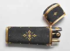 An Etui vanity case having a gilt borders and piqu