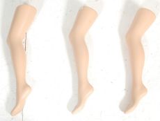 A contemporary French style haberdashery leg display. Three legs in composite construction sitting
