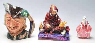 A collection of 20th century Royal Doulton figurines to include Robin Hood D6527, The Potter HN1493,