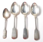 A group of four 19th Century Victorian spoons in the fiddle pattern each having engraved initials to