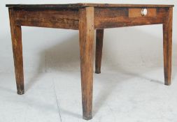 A Victorian 19th century country pine refectory dining table being raised on squared legs with