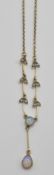 A 9ct gold collar necklace having a repeating leaf design with central opal drop pendant set
