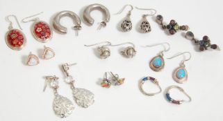 A collection of vintage ladies silver earrings to include a pair of stud back hoop earrings, a