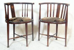 A pair of Edwardian early 20th Century corner oak corner chairs having horseshoe shaped inlaid