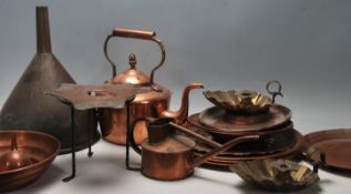 A collection of antique copper wares to include a Victorian kettle, watering can, trivet stand,