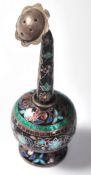 A 20th Century silver white metal pepperette having enamelled cloisonne throughout with decoration