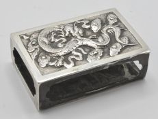 A good 20th century continental silver hallmarked matchbox holder having dragon decoration to one