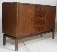 A mid-century retro circa 1950’s Vanson mahogany sideboard credenza being raised on squared legs
