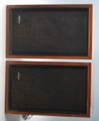 A pair of Sony SS - 210 teak wood cased hi-fi speakers with black facia’s bearing Sony labels.