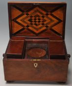 A 19th Century Victorian mahogany tea caddy of rectangular form having a hinge lid with ring handles
