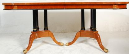 A large impressive regency revival dining table consisting of a maple, satinwood, ebony & boxwood