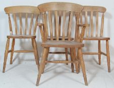 A collection of antique style 20th century Windsor kitchen dinning chairs raised on turned legs