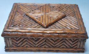 A 20th Century Black forest blackthorn wooden trinket / jewellery box of rectangular form having a