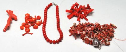 A collection of various vintage 20th Century red coral beads and jewellery pieces to include round