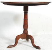 An 18th century George III country oak pedestal ti