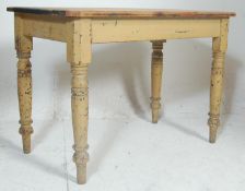 A Victorian 19th century pine scrub top refectory dining table being raised on turned legs and