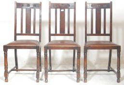 A 1930's oak dining table and chairs having an oak extending dining table raised on four turned
