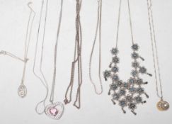 A group of vintage silver necklaces to include a collar necklace with rope twist florals set with