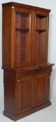 A Victorian 19th century mahogany library bookcase cupboard raised on a plinth base with single