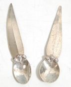 A pair of silver spoons with hammered bowls and unusual tapered handles. Weight 20g