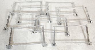 A collection of 8 retro vintage classic car metal luggage racks / boot racks having a horizontal