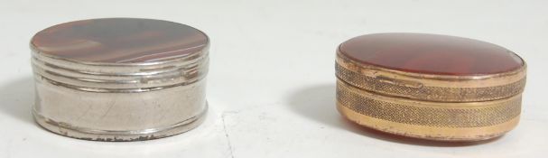 A pair of vintage white metal agate pill boxes with stone oval panels to the lid and base.